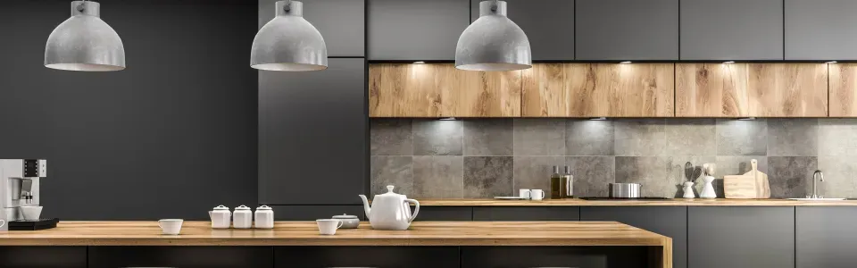 photo of modern minimalist lighting in a gray and neutral woods decorated kitchen